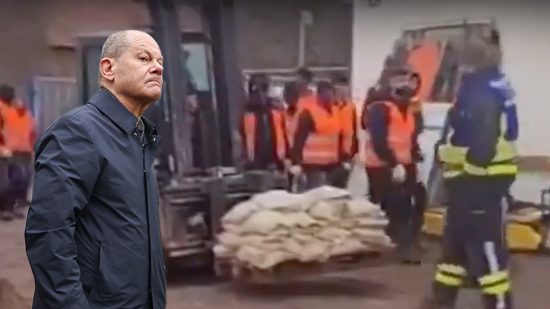 Am Tag, als der Kanzler ins Flutgebiet kam: Warum schippten plötzlich Flüchtlinge Sand?